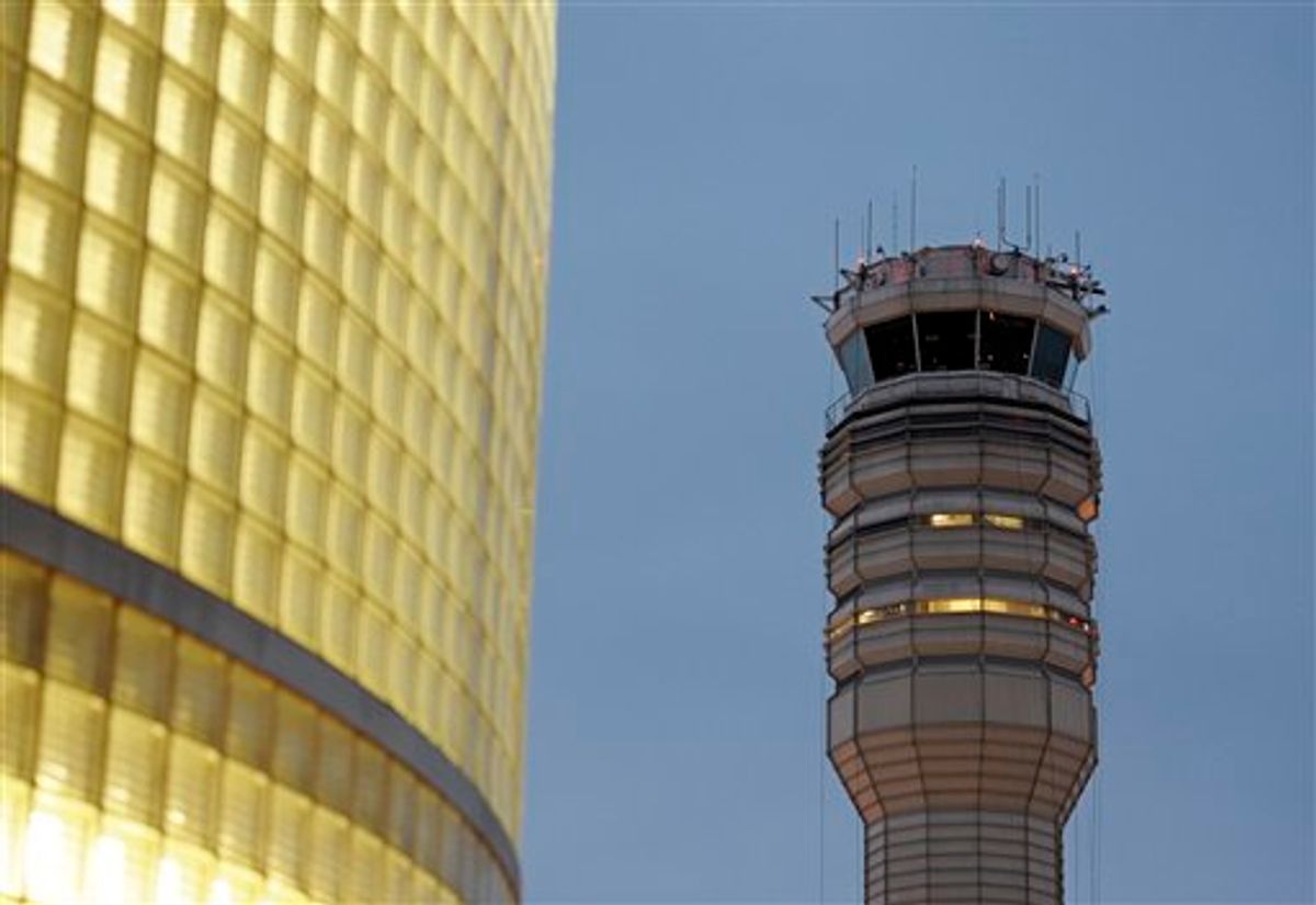 The FAA control tower at Reagan National Airport is seen in Arlington, Wednesday, March 23, 2011. Federal safety officials are investigating a report that two planes landed at the airport without control tower clearance because the air traffic controller was asleep. (AP Photo/Cliff Owen) (AP)