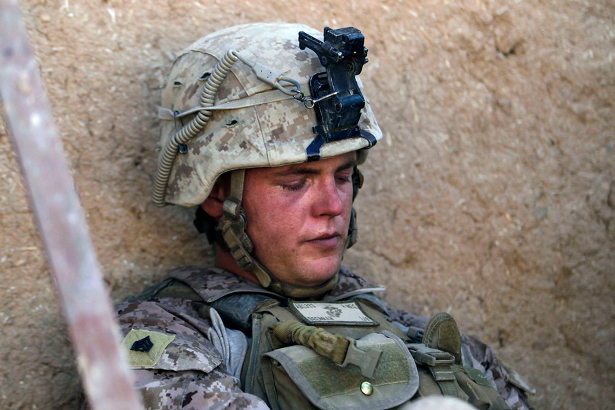 Concussed Sgt. Thomas James Brennan of Randolph, Massachusetts from the 1st Battalion 8th Marines Alpha Company rests in a compound providing cover after a rocket propelled grenade exploded near his position during a battle against Taliban insurgents in the town of Nabuk in southern Afghanistan's Helmand province, November 1, 2010. REUTERS/Finbarr O'Reilly (AFGHANISTAN - Tags: MILITARY CONFLICT) (Â© Finbarr O'reilly / Reuters)