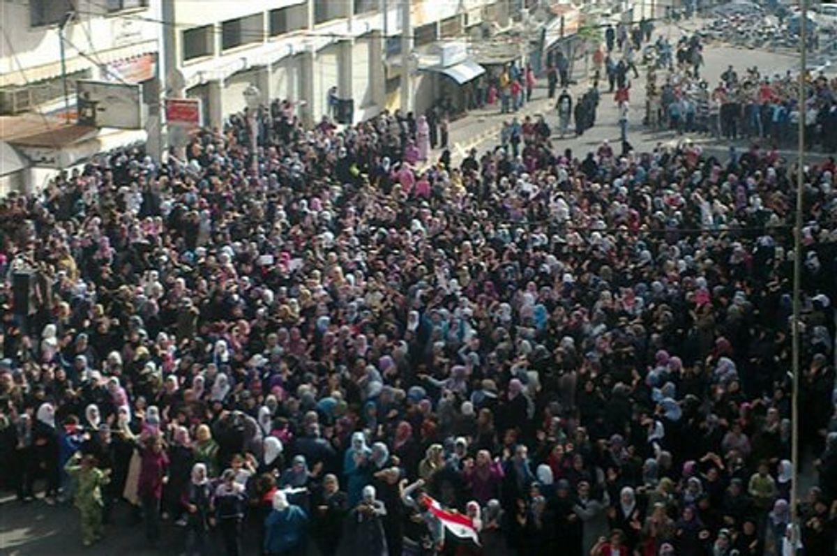 In this citizen journalism image made on a mobile phone and acquired by the AP, Syrian women attend an anti-government protest in Banias, Syria, Saturday, April 16, 2011. President Bashar Assad was expected to appear in a televised speech, witnesses said. The speech will be Assad's second public appearance since the country's protest movement began a month ago. (AP Photo) (AP)