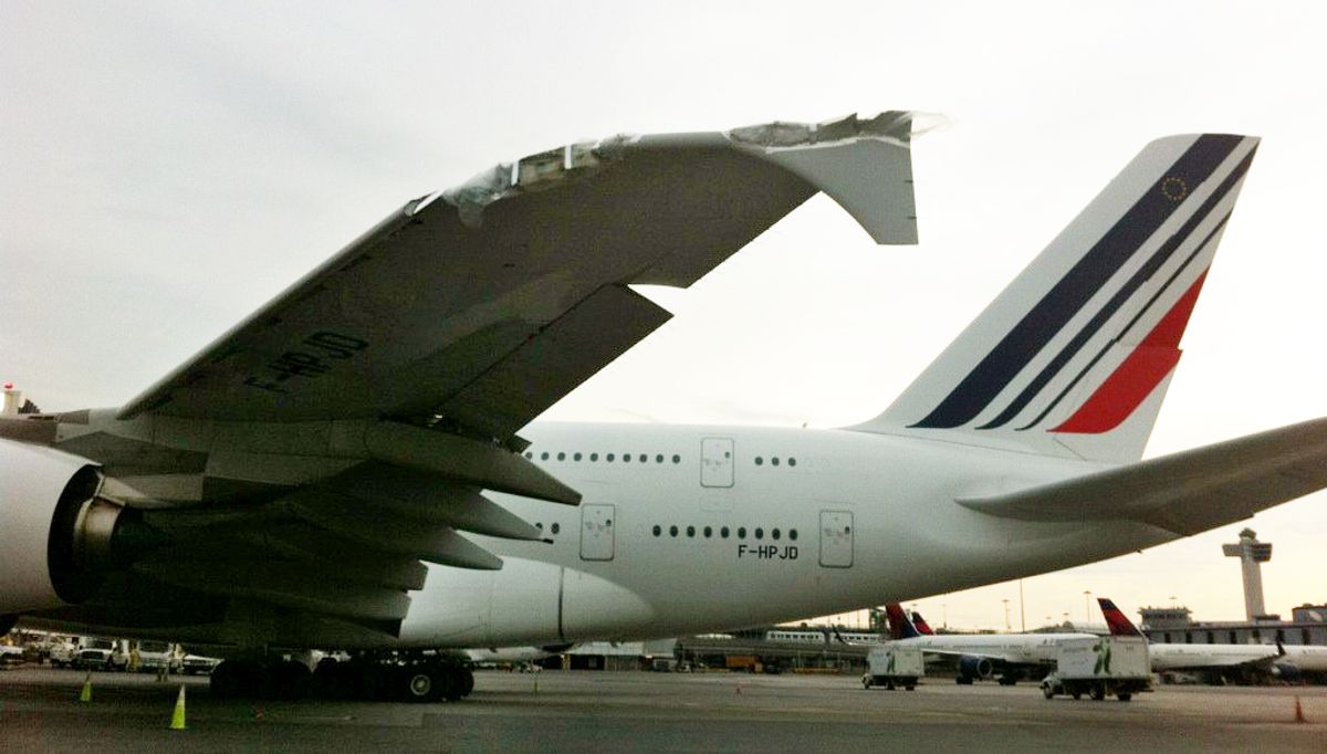 A damaged Airbus A380 belonging to Air France sits on the runway at John F. Kennedy International Airport, Tuesday, April 12, 2011 in New York. The worldâs largest passenger aircraft clipped a much smaller Bombardier CRJ700 on a wet tarmac at JFK on Monday, April 11. No one was injured. (AP Photo/NYCAviation)    (AP)
