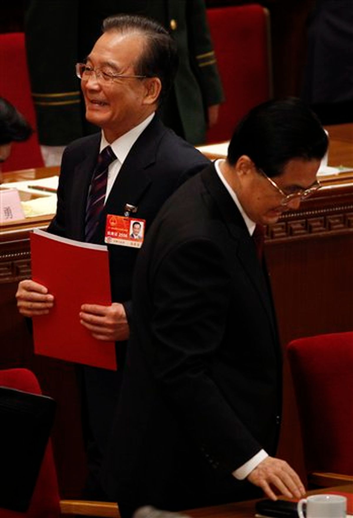 Chinese Premier Wen Jiabao, left, walks next to Chinese President Hu Jintao after the closing session of the annual National People's Congress in Beijing's Great Hall of the People, China, Monday, March 14, 2011. (AP Photo/Vincent Thian)  (AP)
