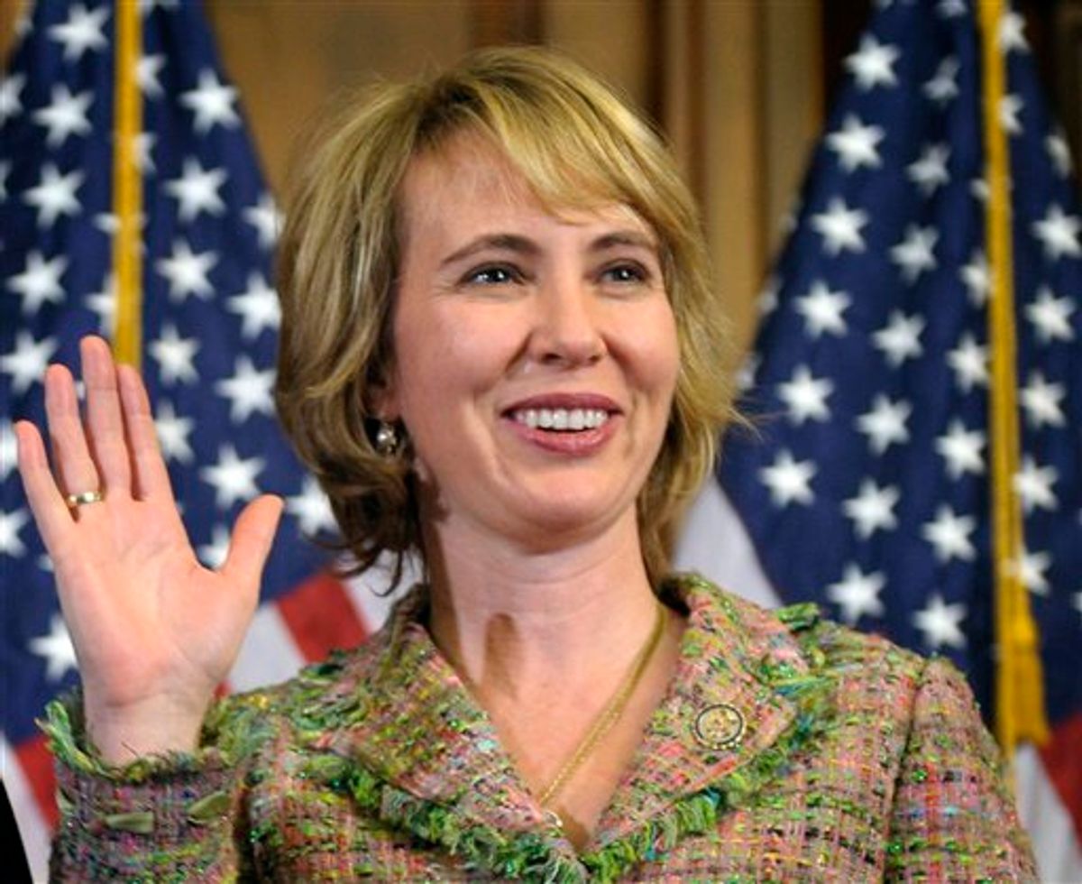 FILE - In this Jan. 5, 2011 file photo, Rep. Gabrielle Giffords, D-Ariz., takes part in a reenactment of her swearing-in, on Capitol Hill in Washington. Time magazine has named Giffords one of the 100 most influential people in the world. (AP Photo/Susan Walsh, File)   (AP)
