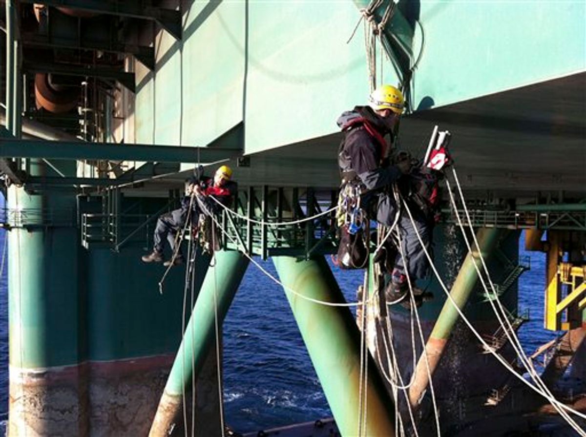 In this photo dated Friday, April 22, 2011 provided by Greenpeace, activists climb aboard the oil rig Leiv Eiriksson to prevent its departure for Greenland to begin drilling in the Arctic, in the Sea of Marmara near Istanbul, Turkey. The environmental group said Friday activists used speedboats to intercept and climb aboard the Leiv Eiriksson as it left Istanbul and were prepared to occupy the rig for days. (AP Photo/Greenpeace, HO) NO SALES (AP)