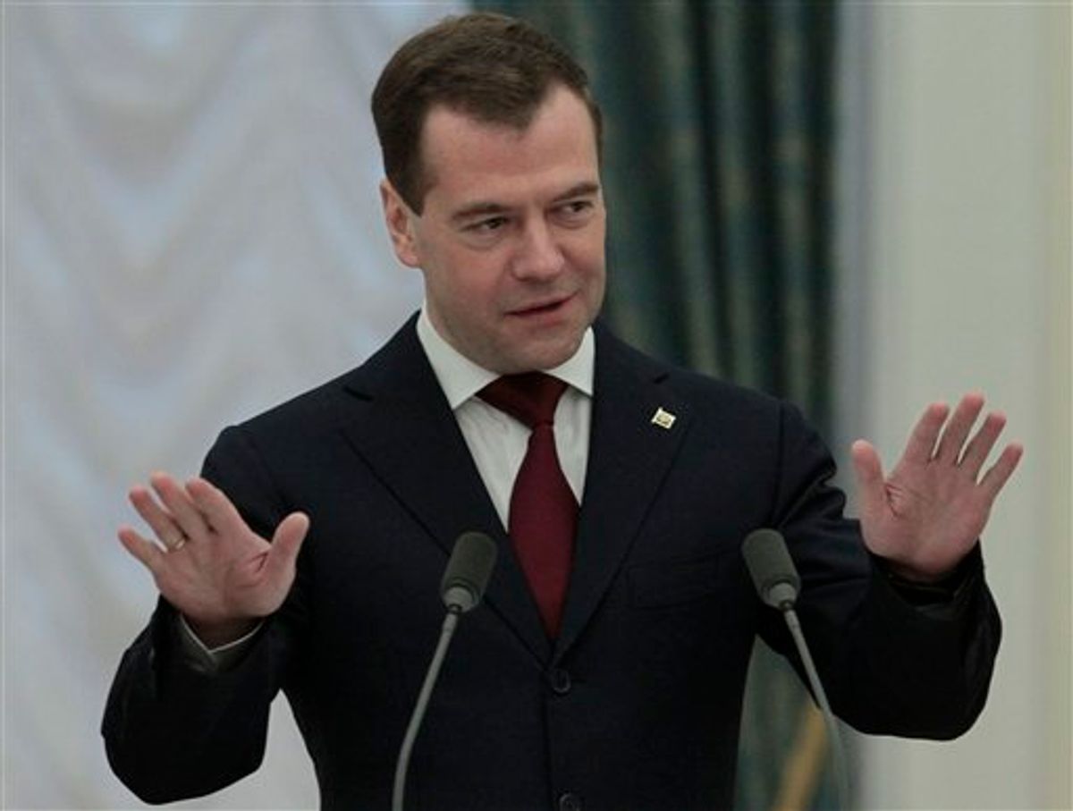 Russian President Dmitry Medvedev gestures while speaking at the award ceremony in the Kremlin in Moscow, Tuesday, April 12, 2011. The ceremony was held to mark the 50th anniversary of Yuri Gagarin's mission, the first human spaceflight. (AP photo/Alexander Natruskin, Pool) (AP)