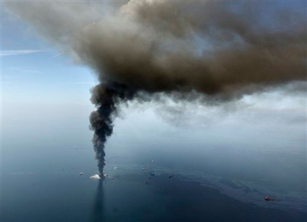 The Deepwater Horizon oil rig burns in the Gulf of Mexico.     (AP/Gerald Herbert)