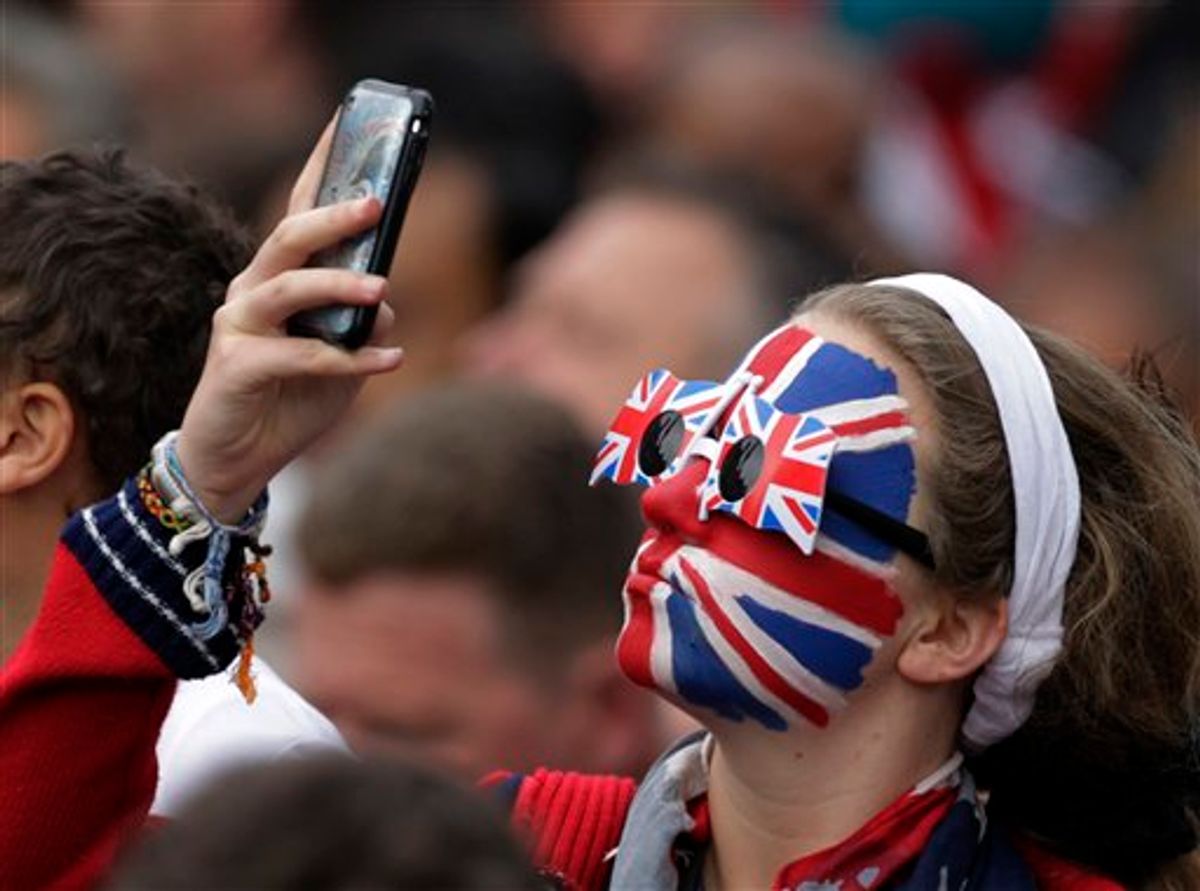 A spectator takes a photo outside of Westminster Abbey before the Royal Wedding of Prince William and Kate Middleton in London Friday, April, 29, 2011. (AP Photo/Gero Breloer)  (AP)