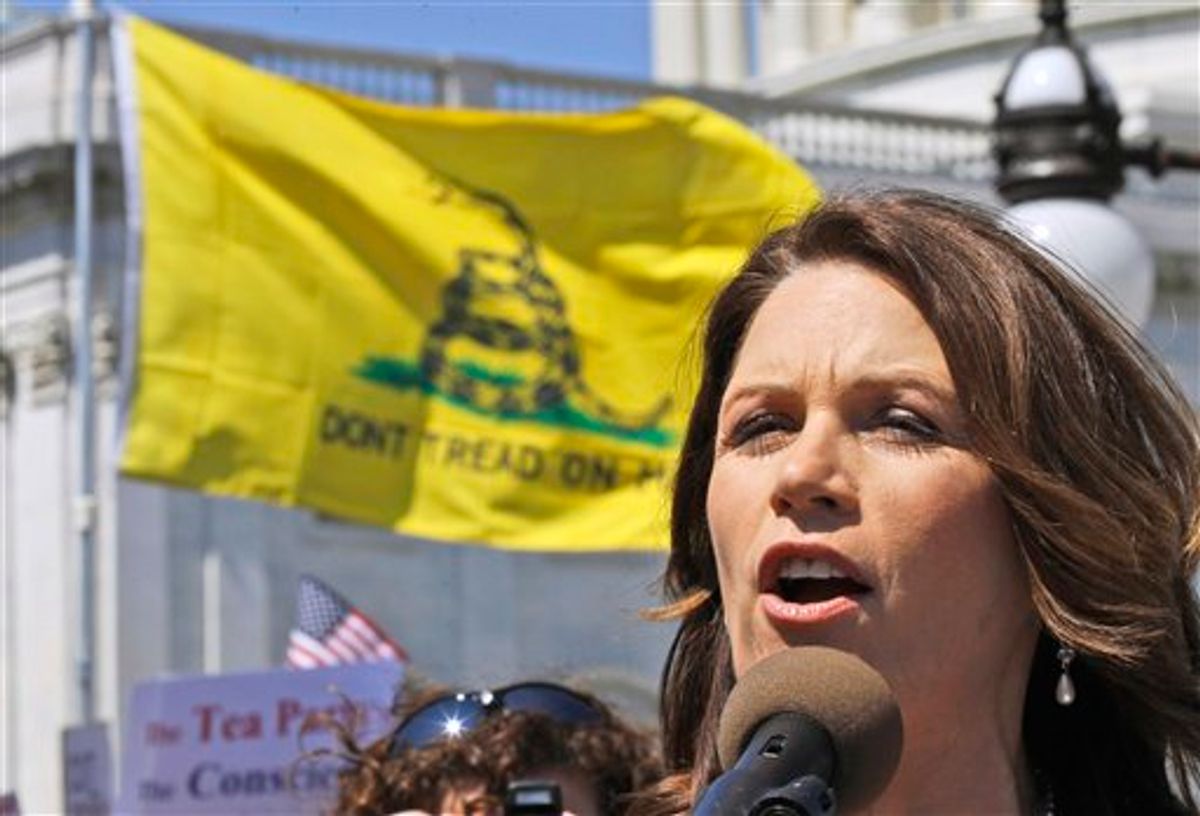 FILE - In this April 6, 2011 file photo, Rep. Michele Bachmann, R-Minn. addresses an Americans for Prosperity "Cut Spending Now," rally on Capitol Hill in Washington. Its the weird issue that wont go away, and its forcing GOP presidential contenders and other Republican leaders to pick sides: do they think President Obama was born outside the United States and is therefore disqualified to be president? Polls show that a remarkable  two-thirds of all Republican voters either think Obama was born abroad or they arent sure. With Donald Trump stirring the pot, other potential candidates are distancing themselves from his comments to varying degrees. (AP Photo/Alex Brandon, File) (AP)