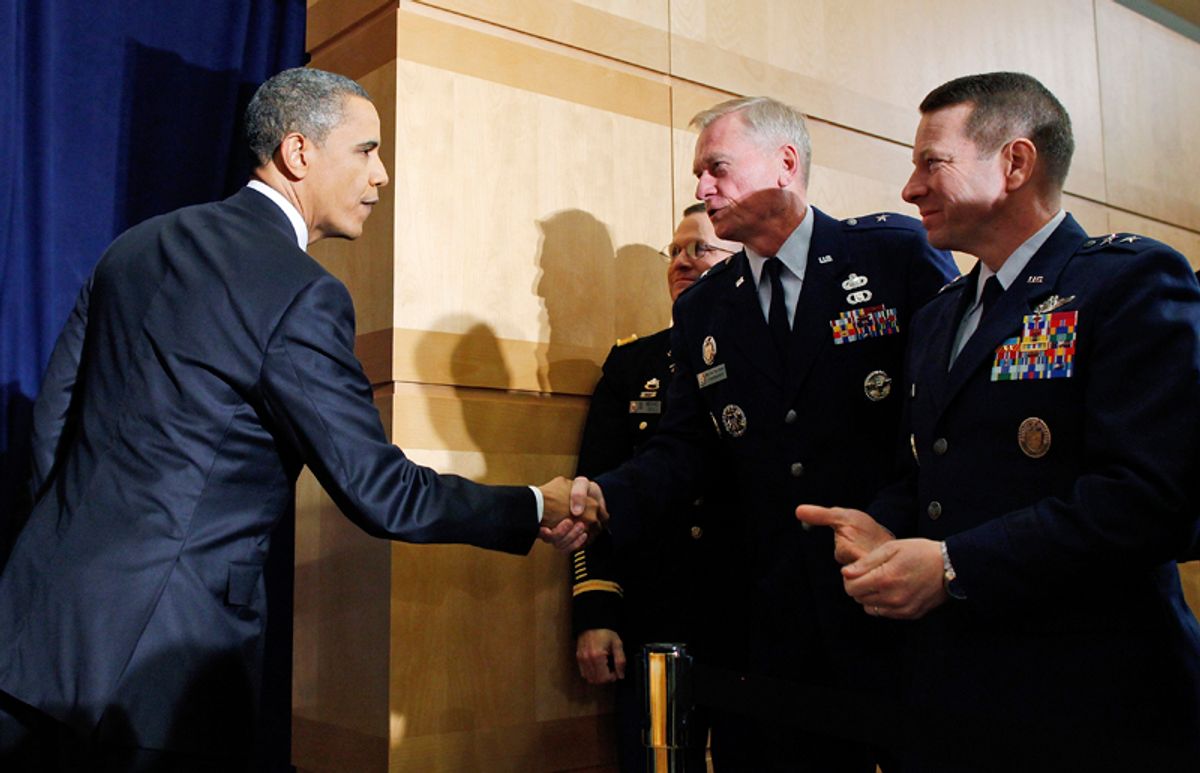 President Barack Obama shakes hands with military officers after he spoke about Libya at the National Defense University in Washington, Monday, March 28, 2011. (AP Photo/Charles Dharapak) (Charles Dharapak)