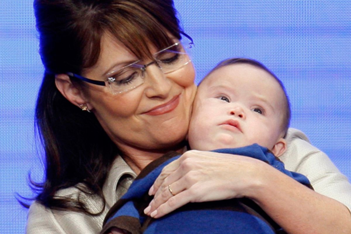 Then Republican vice presidential nominee Alaska Governor Sarah Palin holds her four-month-old son Trig after her speech at the 2008 Republican National Convention in St. Paul, Minnesota September 3, 2008. 
