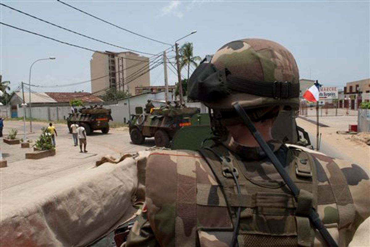 This handout photo provided by  the French Defense Ministry on Sunday April 3, 2011, shows French soldiers patrolling as part of the French Force Licorne, in Port Bouet district of Abidjan, Saturday, April, 2, 2011. The United Nations mission in Ivory Coast began moving some 200 employees out of the main city Sunday after repeated attacks on its headquarters, as fighters loyal to the internationally recognized president prepared for a battle to oust the incumbent leader. (AP Photo/Sch. Blanchet, ECPAD) NO SALES (AP)