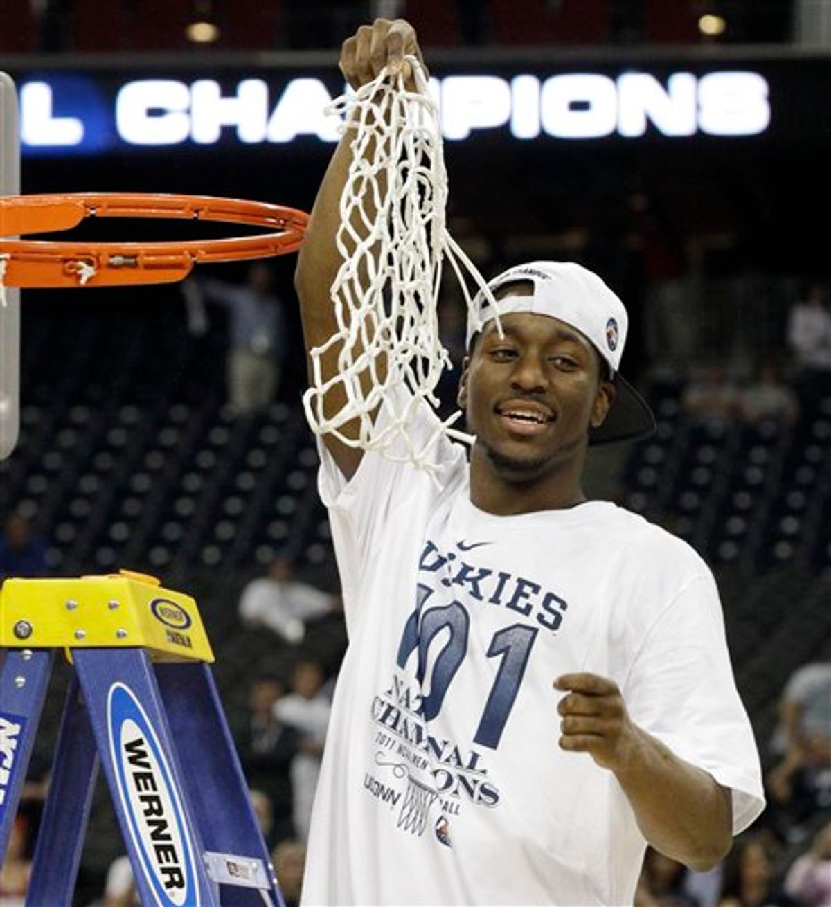 Connecticut's Kemba Walker holds the net after his team won the men's NCAA Final Four college basketball championship game against Butler  53-41 Monday, April 4, 2011, in Houston. (AP Photo/David J. Phillip)  (AP)