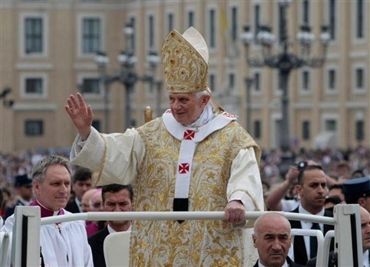 Pope Benedict XVI blesses the faithful upon his arrival in St. Peter's square to celebrate Easter mass at the Vatican, Sunday, April 24, 2011. (AP Photo/Gregorio Borgia) (AP)