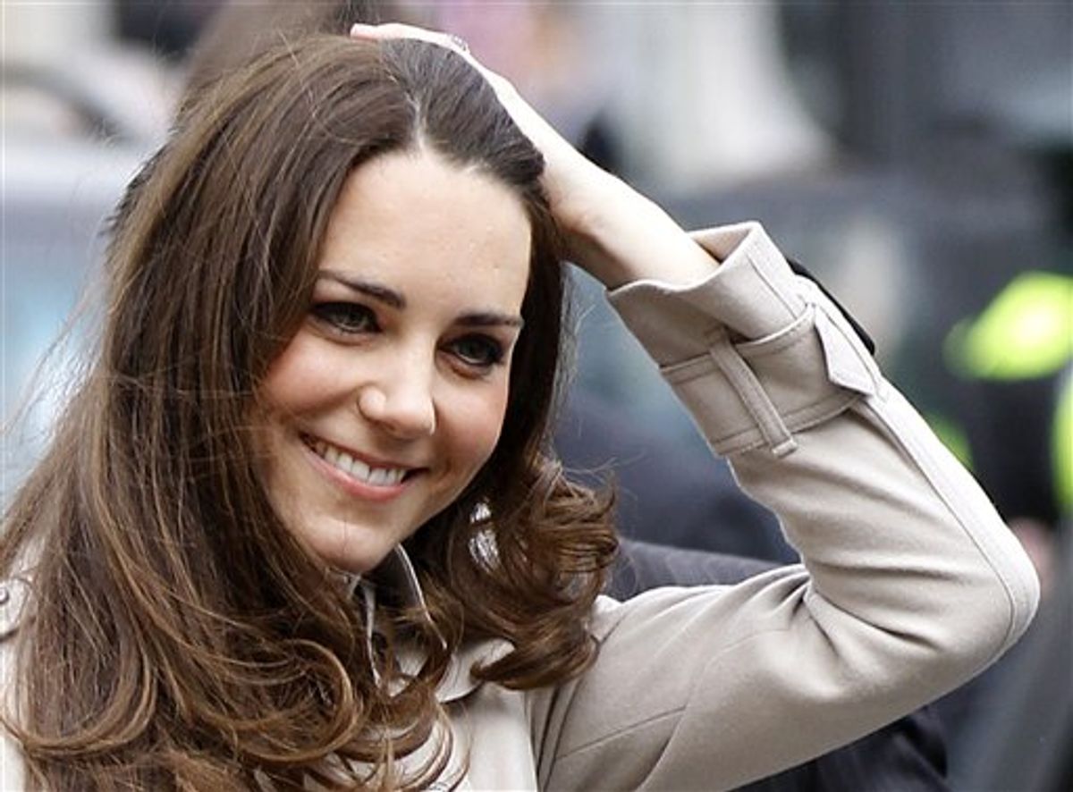 Kate Middleton smiles as she arrives at City Hall in Belfast, Northern Ireland, Tuesday March 8, 2011. Police kept watch from the rooftops for a visit by Britain's Prince William and his fiance, that brought the center of Belfast to a standstill. Some 50 to 100 people gathered in the bright sunshine near the imposing city hall to greet the couple, who arrived in a convoy of five black Range Rovers, but the crowd swelled to several hundred as shoppers realized something special was happening.(AP Photo/Peter Morrison) (AP)