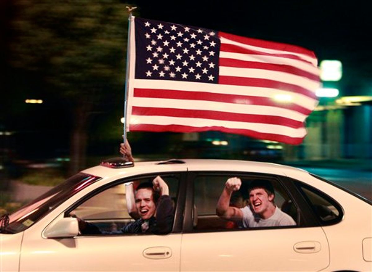 A driver and passengers celebrate the death of Osama bin Laden in the streets of Lawrence, Kan., Sunday, May 1, 2011. President Barack Obama announced Sunday night, May 1, 2011, that Osama bin Laden was killed in an operation led by the United States.(AP Photo/Orlin Wagner) (AP)