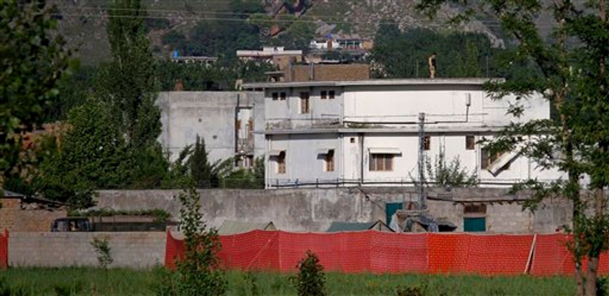 FILE - In this May 2, 2011 file photo, a Pakistan army soldier stands on top of the house where it is believed al-Qaida leader Osama bin Laden lived in Abbottabad, Pakistan. The Americans who raided Osama bin Laden's lair met far less resistance than the Obama administration described in the aftermath, according to its latest account. The commandos encountered gunshots from only one man, whom they quickly killed, before sweeping the house and shooting others, who were unarmed, a senior defense official said. (AP Photo/Anjum Naveed, File) (AP)