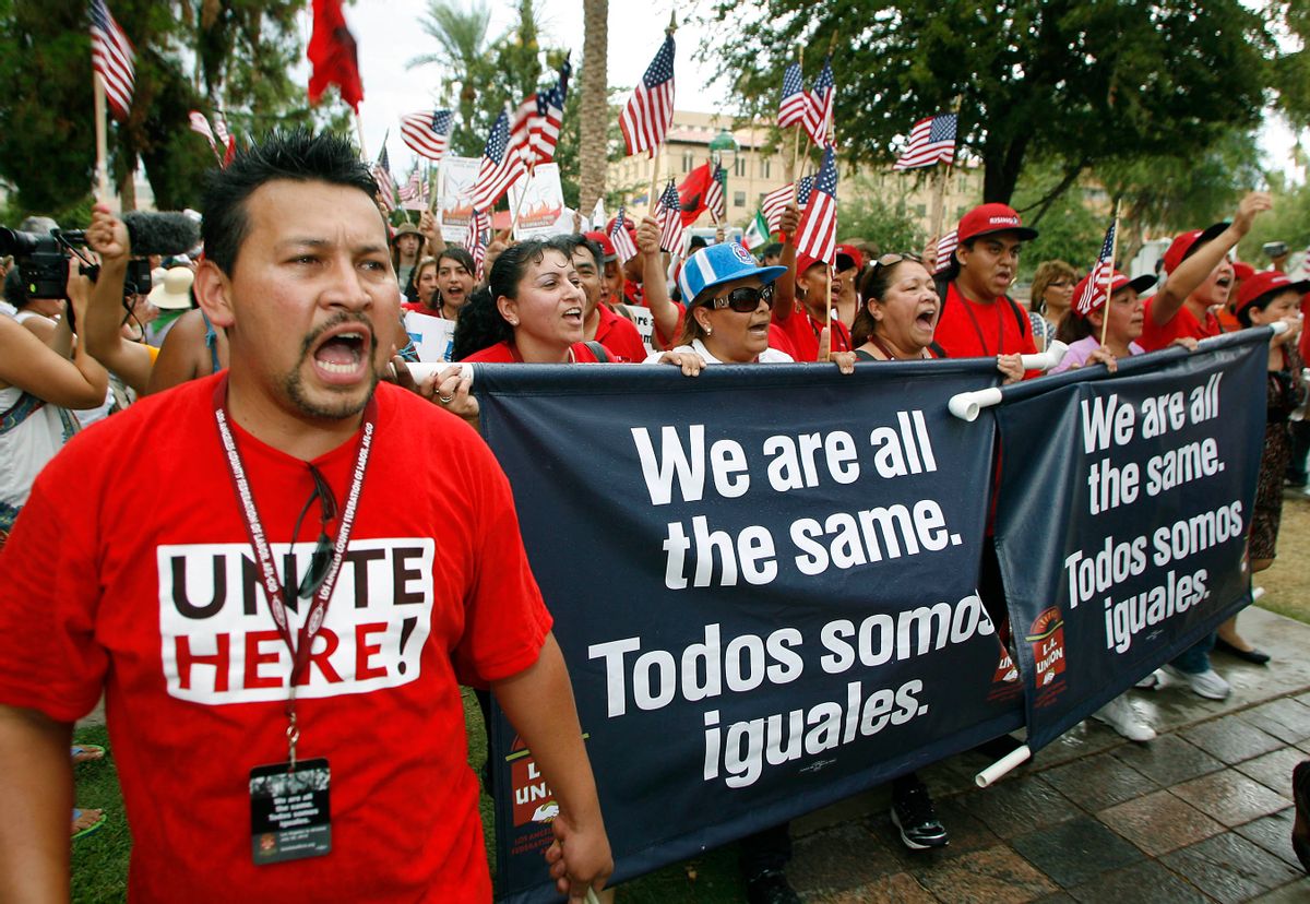 Hundreds of members of the Los Angeles County Federation of Labor march to the Arizona state capitol building in protest of Arizona's SB1070 immigration-enforcement law Thursday, July 29, 2010 in Phoenix. (AP Photo/Ralph Freso)   (Ralph Freso)