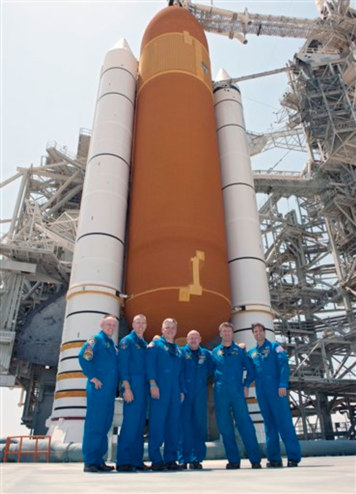 In this picture made available by NASA, the last crew of the space shuttle Endeavour stands together on Launch Pad 39A in front of its external fuel tank and solid rocket boosters at the Kennedy Space Center in Cape Canaveral, Fla. on Thursday, April 28, 2011, one day before its final flight. From left are Mission Specialists Michael Fincke, Andrew Feustel, Pilot Greg H. Johnson, Commander Mark Kelly, European Space Agency astronaut Roberto Vittori and Mission Specialist Greg Chamitoff. (AP Photo/NASA, Kim Shiflett)    (AP)