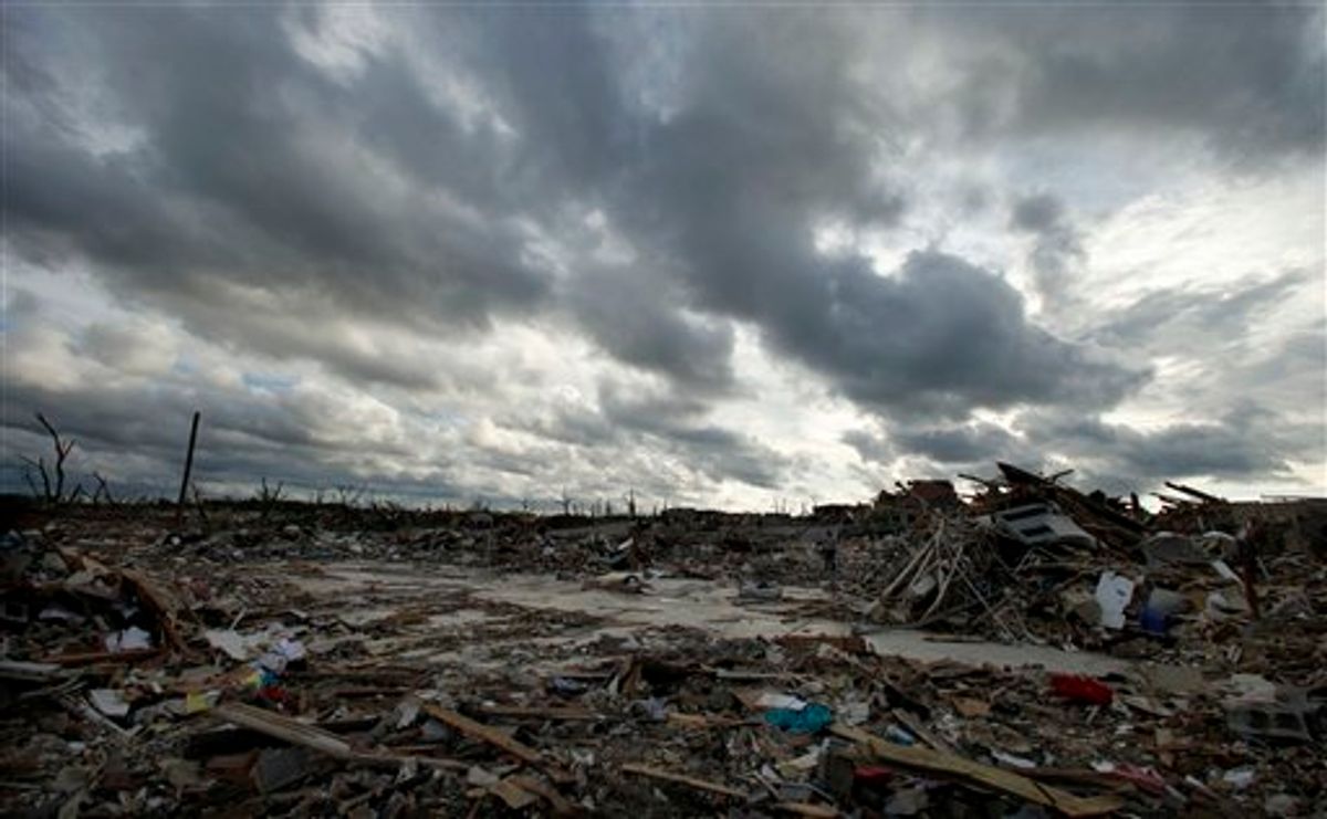 Storm clouds pass over the devastated Greenbriar Nursing Home in Joplin, Mo. Wednesday, May 25, 2011. Eleven residents of the facility died when an EF-5 tornado tore through much of the city Sunday, damaging a hospital and hundreds of homes and businesses and killing at least 122 people. (AP Photo/Charlie Riedel)  (AP)