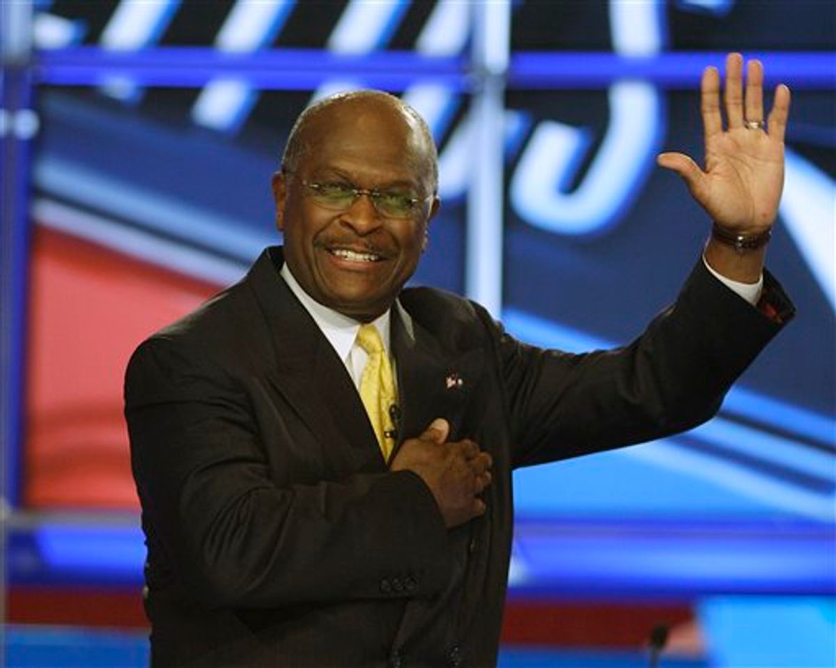 Businessman Herman Cain waves as he takes the stage before the first New Hampshire Republican presidential debate at St. Anselm College in Manchester, N.H., Monday, June 13, 2011. (AP Photo/Stephan Savoia) (AP)