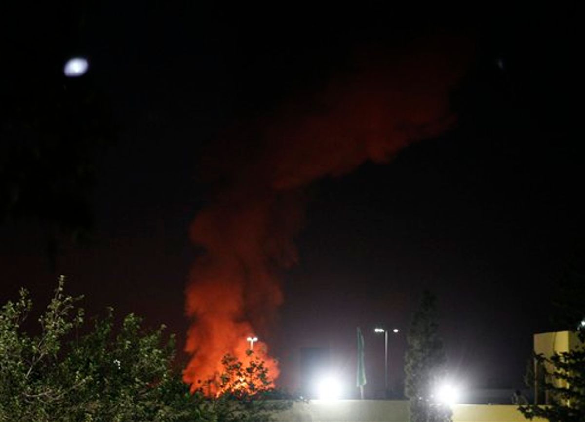A plume of smoke and fire is seen after an airstrike in Tripoli, Libya, on Tuesday, June 14, 2011. NATO resumed its airstrike on the Libyan capital of Tripoli late Tuesday, blasting at least two targets just before midnight, after military leaders voiced concerns about sustaining the operations if the alliance mission drags on. (AP Photo/Ivan Sekretarev) (AP)