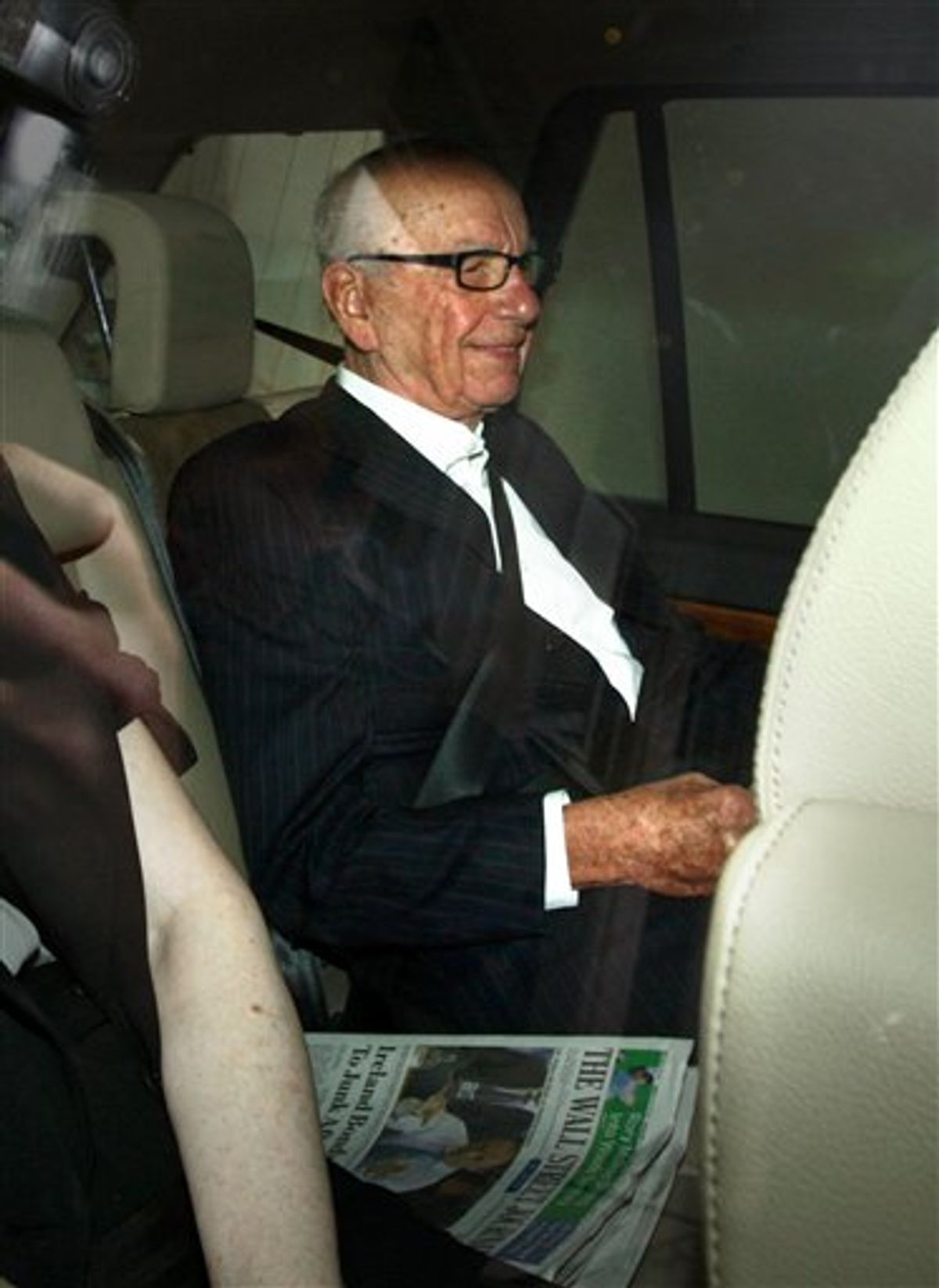 Rupert Murdoch leaves his home in Mayfair, London, as British Prime Minister David Cameron joined demands for the media mogul to drop his BSkyB takeover bid in the wake of the phone-hacking scandal Wednesday July 13, 2011. Britain's House of Commons is poised to demand that Rupert Murdoch give up on his ambition of taking over a lucrative broadcaster while a phone hacking scandal rages around his British newspaper holdings. Cameron has put his party's weight behind an opposition motion up for a vote Wednesday which declares that bidding for full control of British Sky Broadcasting would not be in the national interest. (AP Photo/Steve Parsons)  UNITED KINGDOM OUT NO SALES NO ARCHIVE (AP)