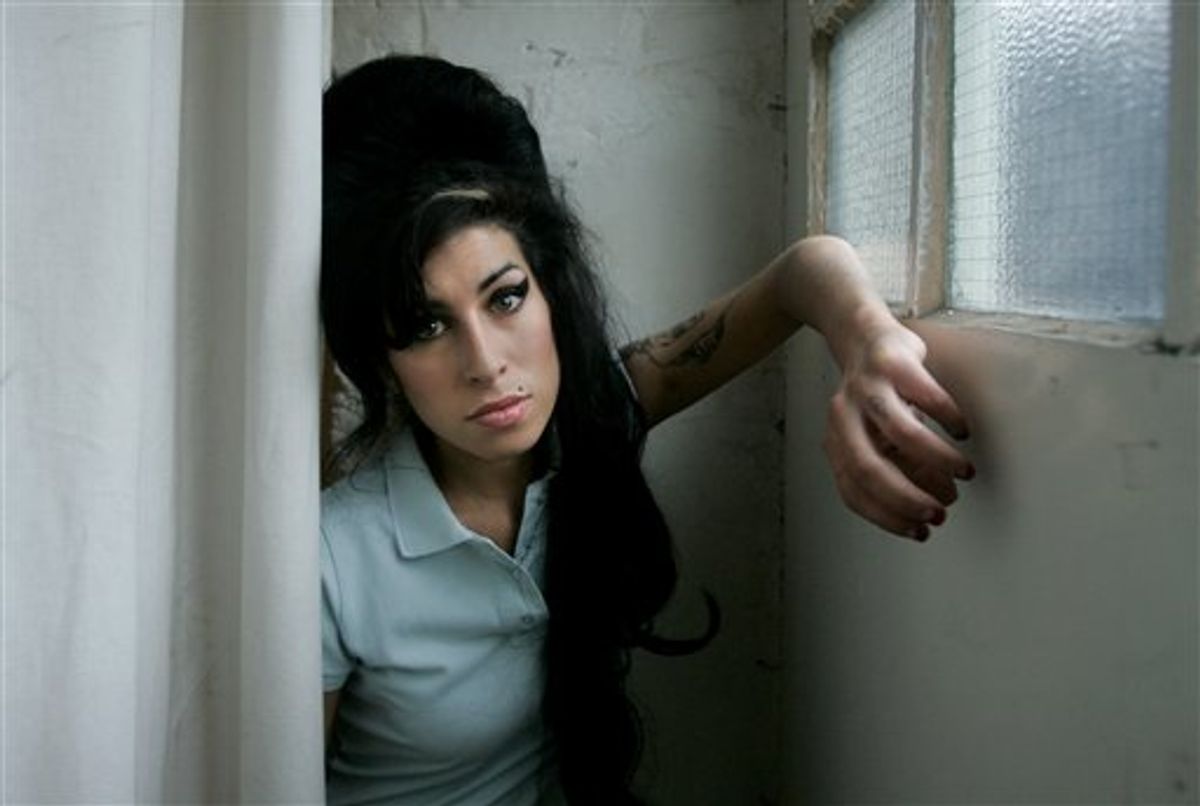 FILE - In this Feb. 16, 2007 file photo, British singer Amy Winehouse poses for photographs after being interviewed by The Associated Press at a studio in north London, Friday, Feb. 16, 2007. British police say singer Amy Winehouse has been found dead at her home in London on Saturday, July 23, 2011. The singer was 27 years old. (AP Photo/Matt Dunham, File) (AP)
