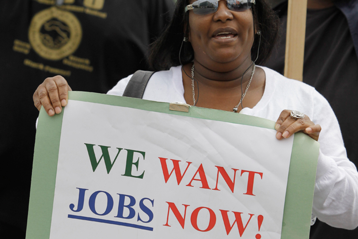 Unemployed Deanna Rice holds up a sign at a workers rally in San Francisco, Thursday, Sept. 16, 2010.