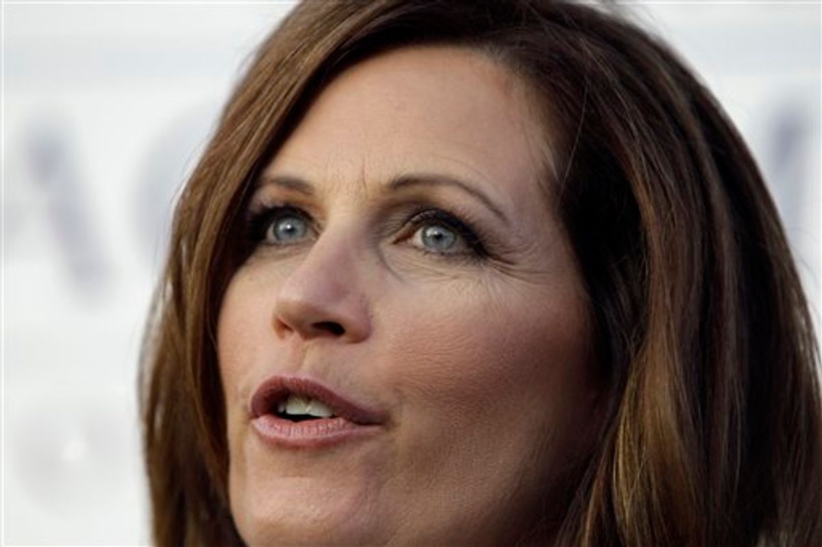 Republican presidential candidate Rep. Michele Bachmann, R-Minn., speaks outside her campaign bus after the Black Hawk County Republican Lincoln Day Dinner, Sunday, Aug. 14, 2011, in Waterloo, Iowa. (AP Photo/Charlie Neibergall) (AP)