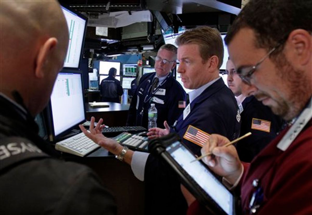 Specialist Michael O'Mara, center, works with traders at the closing bell, on the floor of the New York Stock Exchange Friday, Aug. 12, 2011. A wild week ended relatively calmly on Wall Street Friday as the Dow today gained 126 points to 11,269 and the S&amp;P was up 6 points, while the Nasdaq composite added 15 points. The key averages were down 1 percent or more for the week. (AP Photo/Richard Drew) (AP)