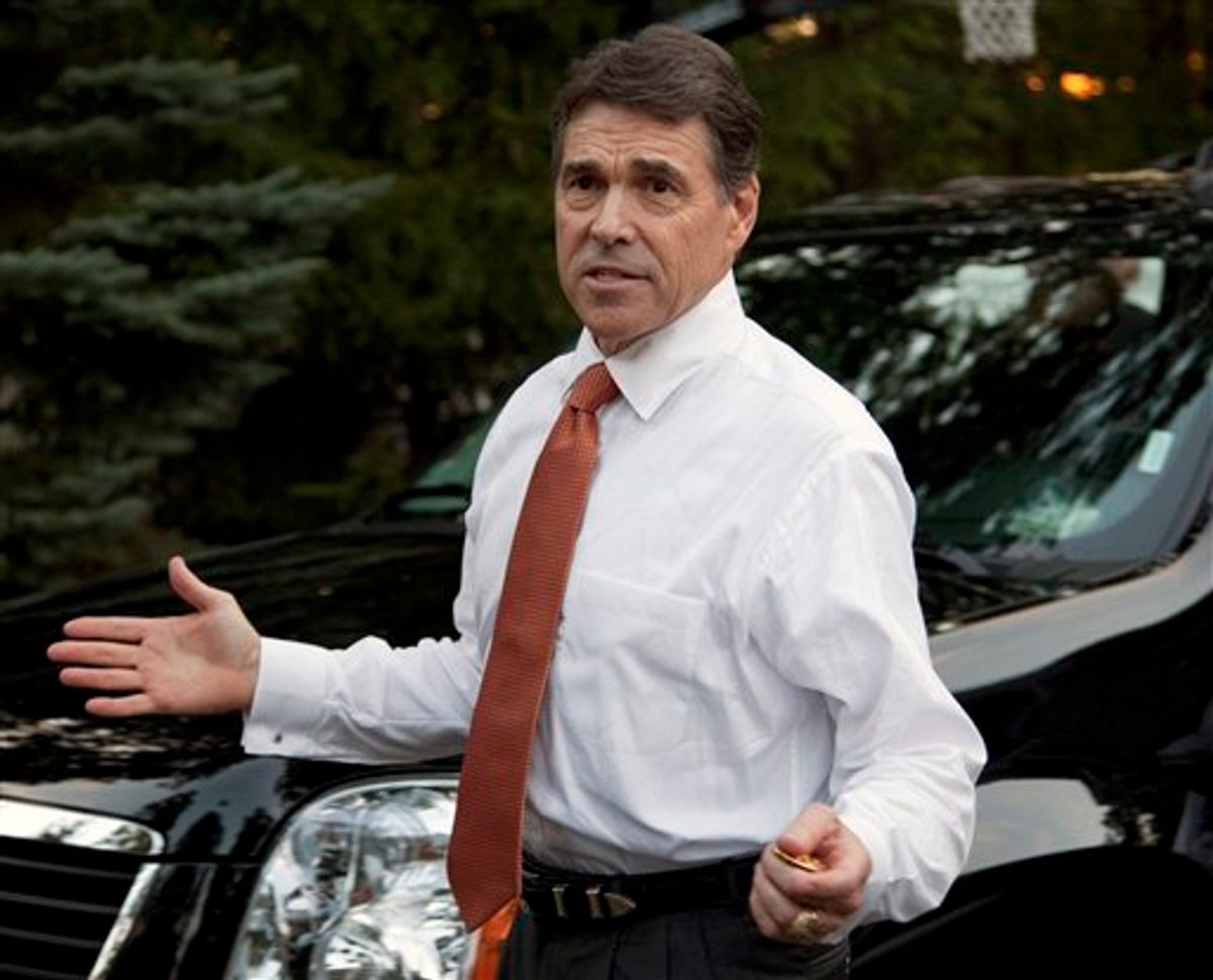 Gov. Rick Perry, R-Texas, answers reporters' questions as he leaves his first campaign event on Saturday, Aug. 13, 2011, in Greenland, N.H. after announcing earlier in the day that he's running for President in 2012. (AP Photo/Evan Vucci) (AP)