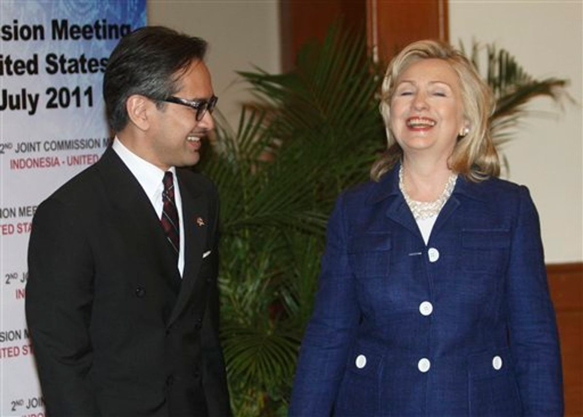 U.S. Secretary of State Hillary Rodham Clinton, right, shares a light moment with Indonesian Foreign Minister Marty Natalegawa at the Joint Commission Meeting Indonesia-U.S. in Nusa Dua, Bali, Indonesia, Sunday, July 24, 2011.  (AP Photo/Dita Alangkara) (AP)