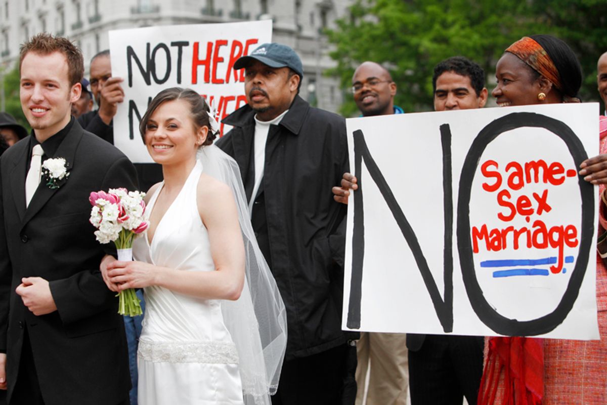 Jonathan Paul Ganucheau, 24, left, and, Denise Buckbinder Ganucheau, 26, both of Dallas, Texas, have a religious wedding ceremony performed as part of a protest against same sex marriage