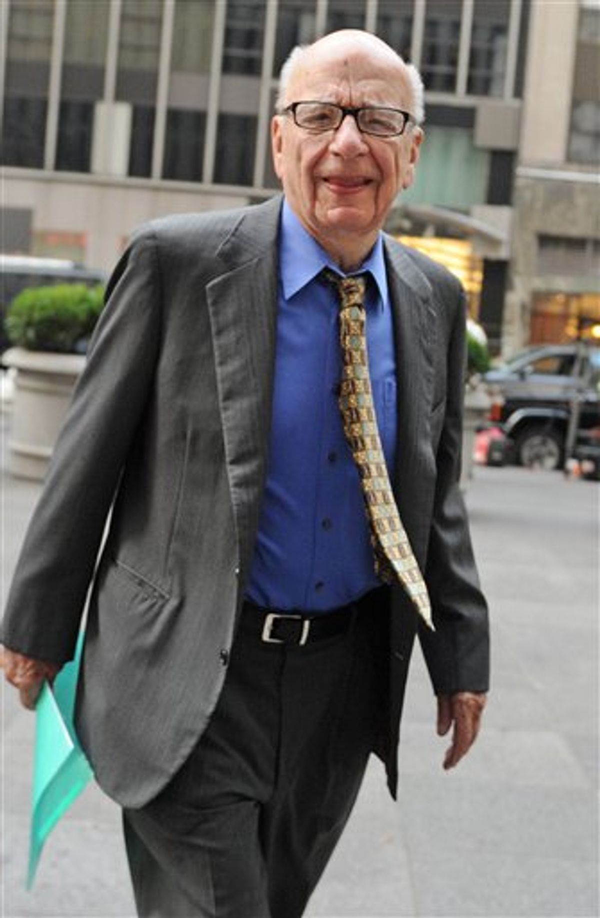 FILE - In this July 22, 2011 file photo, News Corporation head Rupert Murdoch enters the News Corp. building, in New York. News Corp. reports quarterly financial results Wednesday, Aug. 10, 2011, after the market close. (AP Photo/Louis Lanzano, File) (AP)
