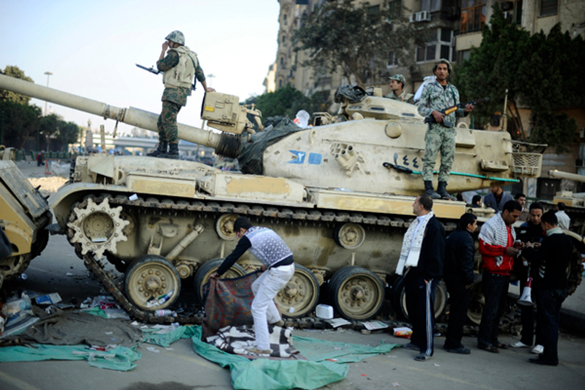 Egyptian soldiers stand on a tank in Cairo     (Dylan Martinez / Reuters)
