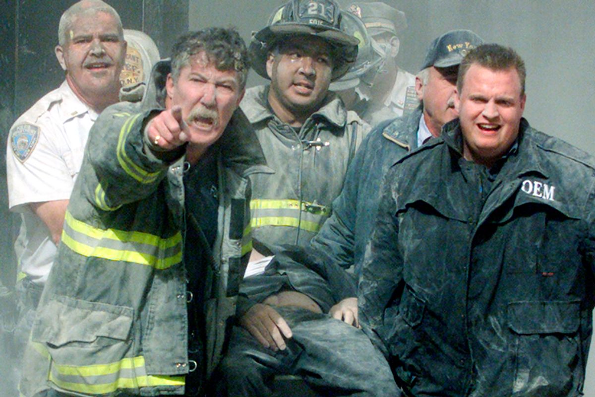Rescue workers remove a man from the World Trade Center tower in New York
City early September 11, 2001. Both towers were hit by planes crashing into
the building. Victims from the attack on the World Trade Center - many
suffering from extensive burns - began arriving at hospitals in New York
City about an hour after two planes slammed into the twin towers, witnesses
said Tuesday. REUTERS/Shannon Stapleton

JC/ME (Reuters)