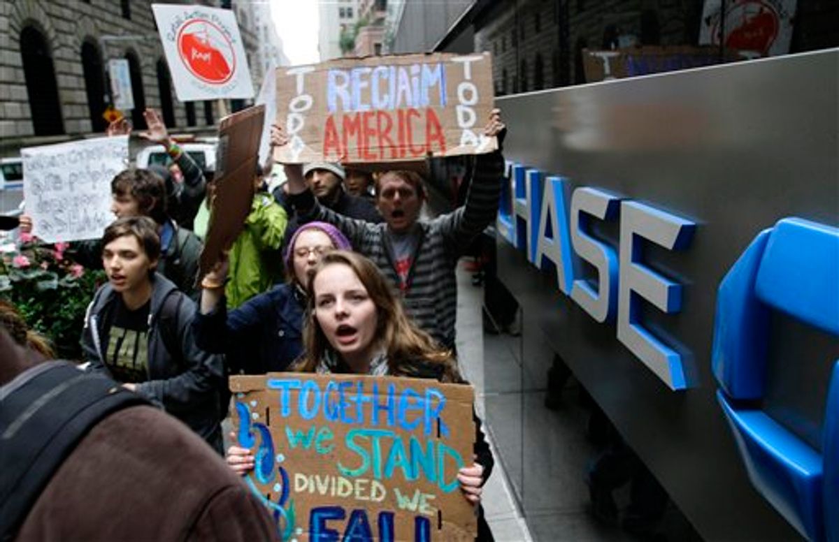 Occupy Wall Street protesters march around One Chase Manhattan Plaza on Wednesday, Oct. 12, 2011 in New York.   (AP/Bebeto Matthews)
