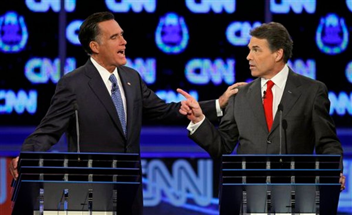 Republican presidential candidates former Massachusetts Gov. Mitt Romney, left, and Texas Gov. Rick Perry speak during a Republican presidential debate Tuesday, Oct. 18, 2011, in Las Vegas.  (AP Photo/Chris Carlson)     (AP)