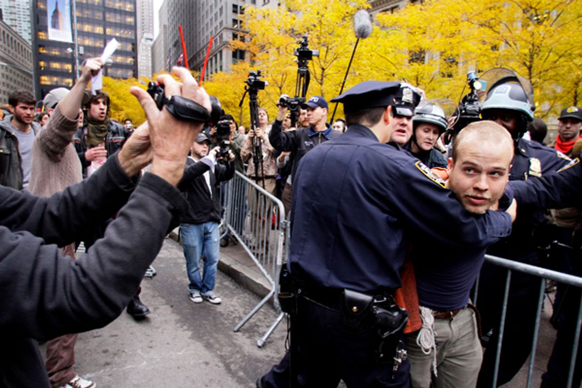 Police arrest an Occupy Wall Street protester at Zuccotti Park on Tuesday, Nov. 15, 2011 in New York.          (AP/Bebeto Matthews)