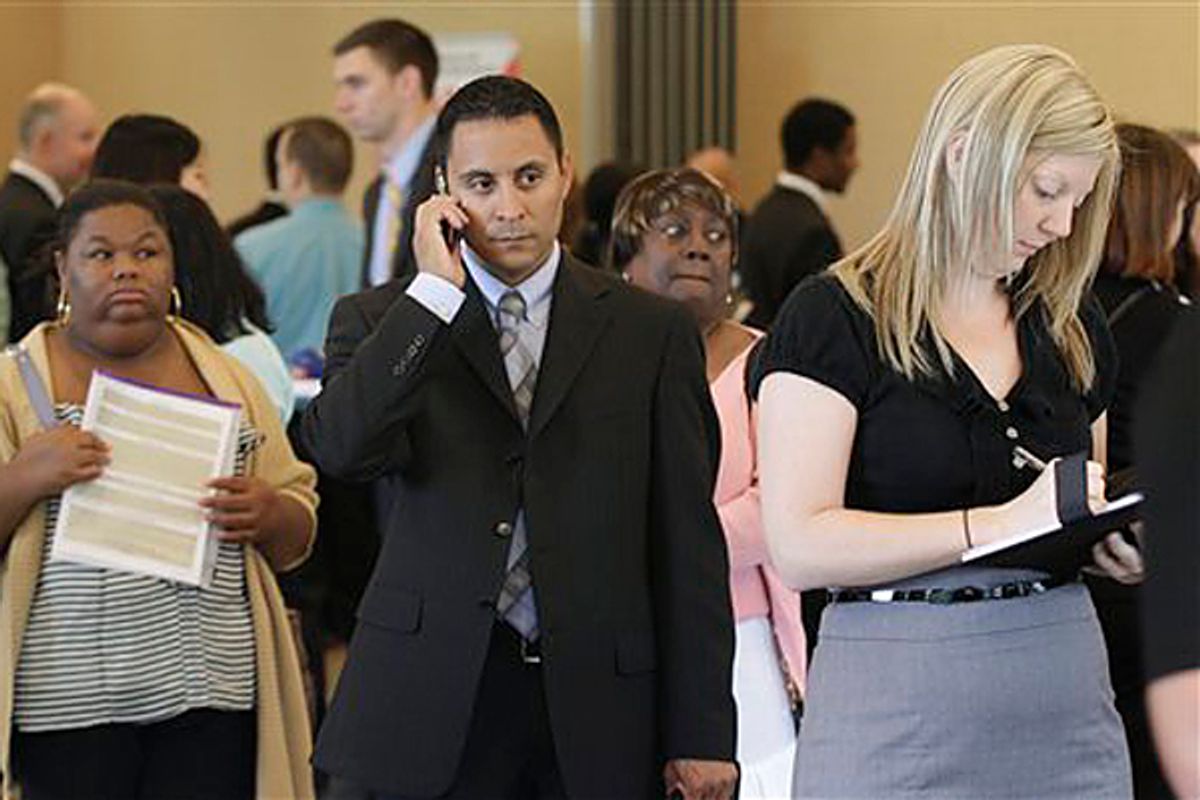 Nichole Smith, left, Lorenzo Ortiz, center, and Annelie Ingvarsson, right, wait in line to talk to potential employers during a National Career Fairs job fair, in Bellevue, Wash.     (Ted S. Warren/AP)