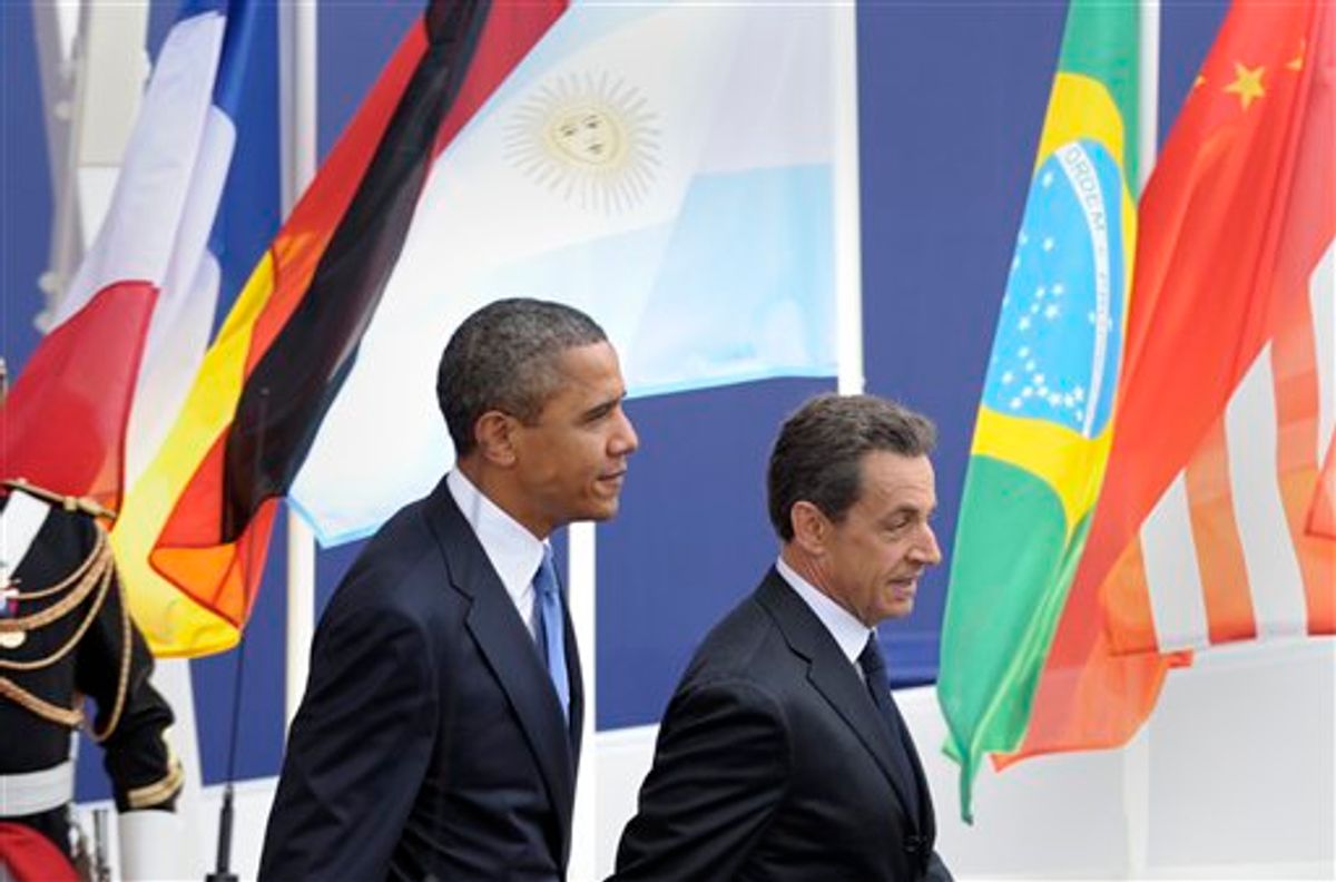 U.S. President Barack Obama, left, walks with French President Nicholas Sarkozy after Obama's arrival for the G20 summit in Cannes, France, Thursday, Nov. 3, 2011.    (AP/Susan Walsh)