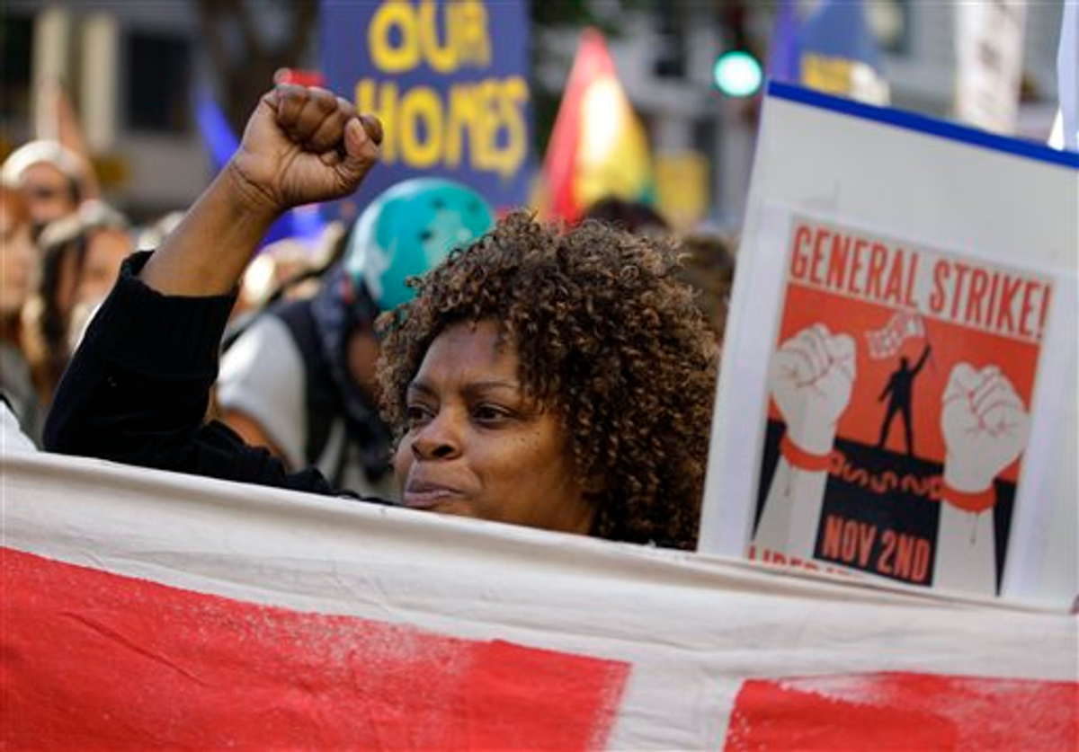 A woman marches with Occupy Oakland protesters on Wednesday.   (AP Photo/Ben Margot)