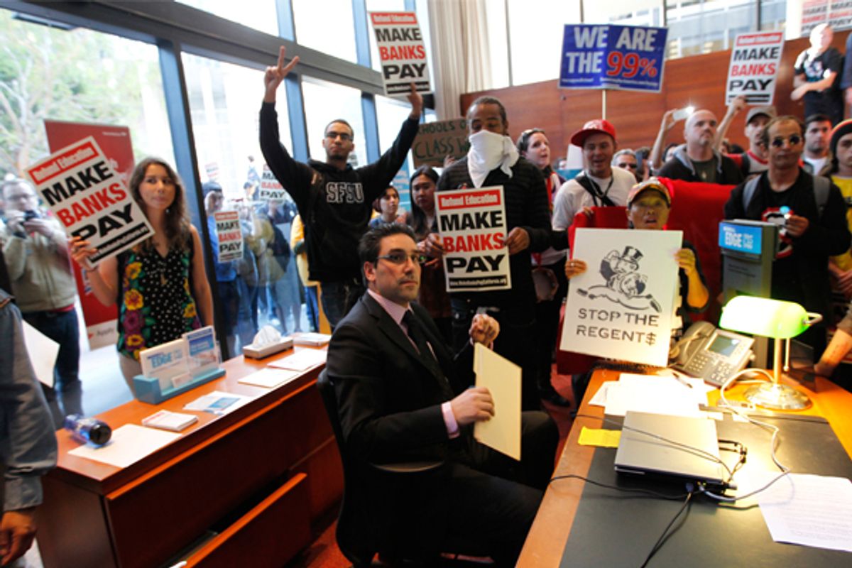 A banker is surrounded by Occupy San Francisco protesters who took over a Bank of America branch on Nov. 16.   (Reuters/Robert Galbraith)