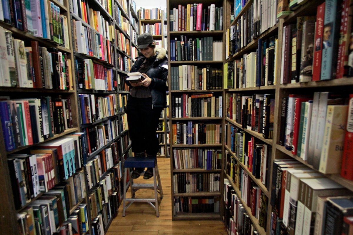  Meghan Hetfield searches the bookshelves at the Strand bookstore       (AP)