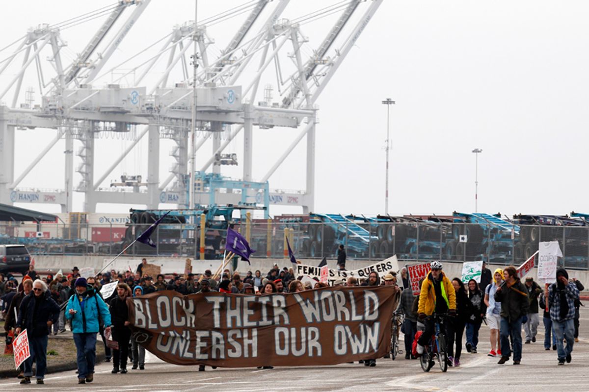 Protestors leave the Port of Oakland after successfully blocking the entrances on December 12.   (AP/Beck Diefenbach)