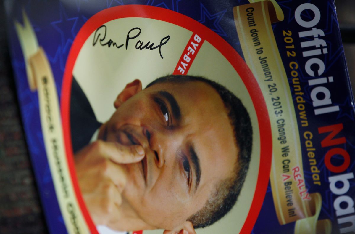 The signature of Rep. Ron Paul, R-Texas, is shown on the cover of an "Obama Countdown Calendar" during a campaign stop in Atlantic, Iowa, Thursday.   (AP Photo/Charles Dharapak)