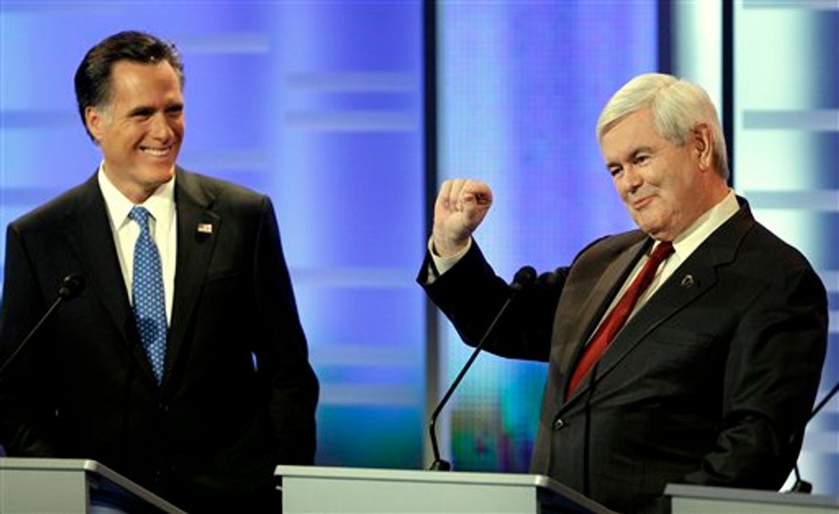 Republican presidential candidates former Massachusetts Gov. Mitt Romney, left, and former Speaker of the House Newt Gingrich, right, take part in the Republican debate, Saturday, Dec. 10, 2011, in Des Moines, Iowa. (AP Photo/Charlie Neibergall)       (AP)
