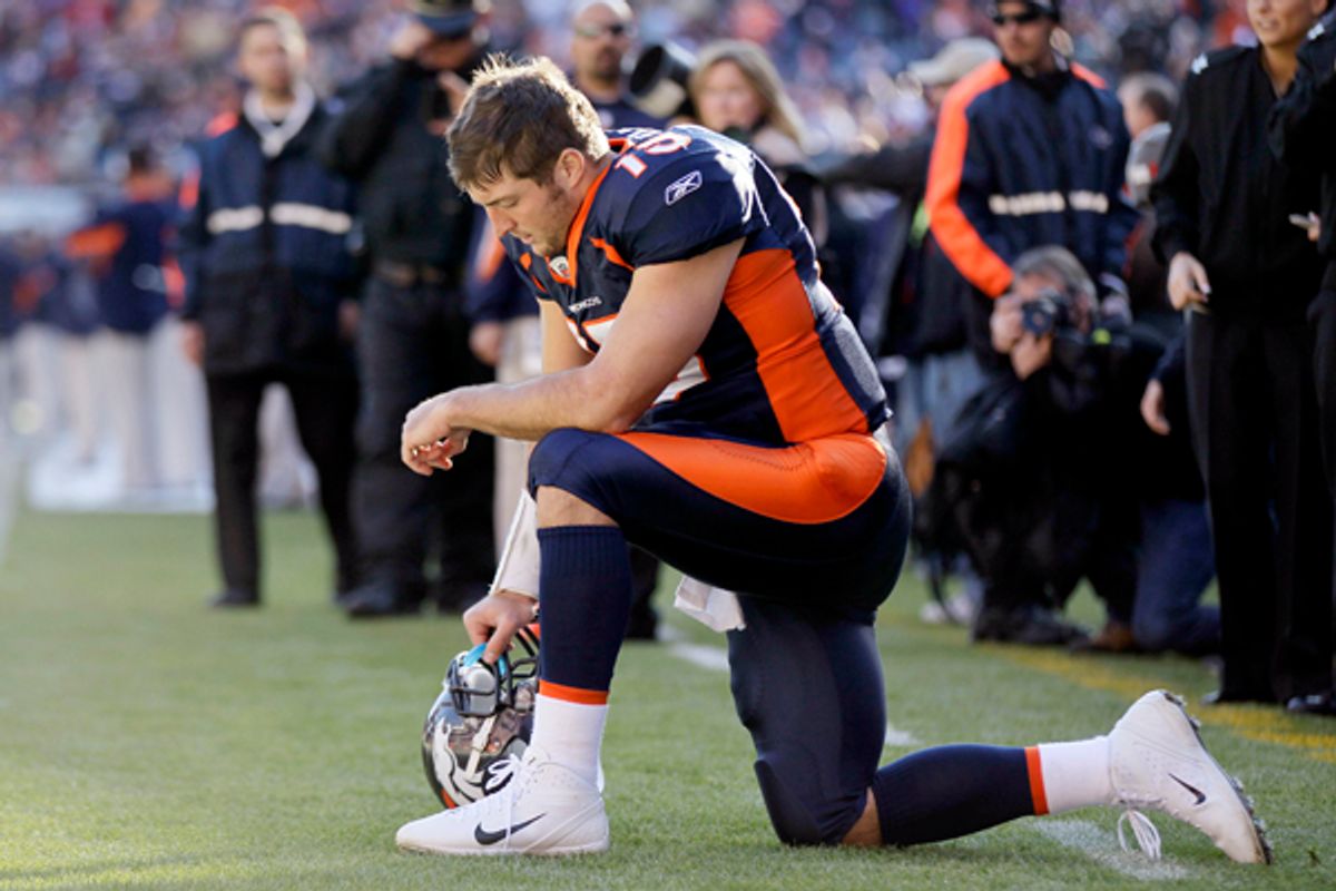 Denver Broncos quarterback Tim Tebow (15) prays in the end zone before the start of an NFL football game against the Chicago Bears, Sunday, Dec. 11, 2011, in Denver.       (AP/Julie Jacobson)