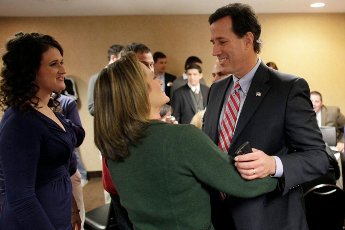 Republican presidential candidate and former U.S. Senator Rick Santorum with his wife Karen Garver Santorum (C) and daughter Elizabeth as he reacts to Iowa Caucus voting results at a caucus rally in Johnston, Iowa, January 3, 2012.     (John Gress / Reuters)