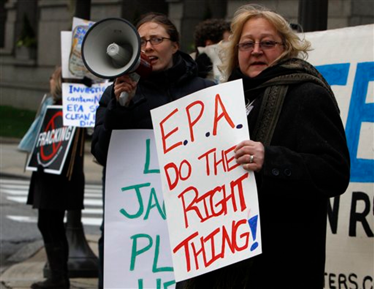 Protesters in front of the Academy of Natural Sciences in Philadelphia before an appearance by Environmental Protection Agency (EPA) Administrator Lisa Jackson Friday Jan. 13, 2012  (AP Photo/Jacqueline Larma)