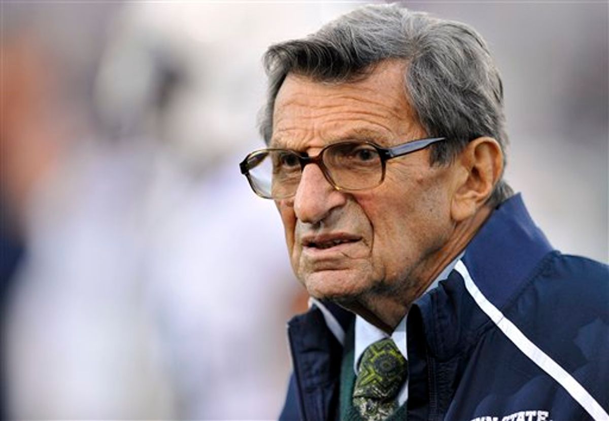 In this Oct. 22, 2011 file photo, Penn State coach Joe Paterno stands on the field before his team's NCAA college football game against Northwestern, in Evanston, Ill.  (AP/Jim Prisching)